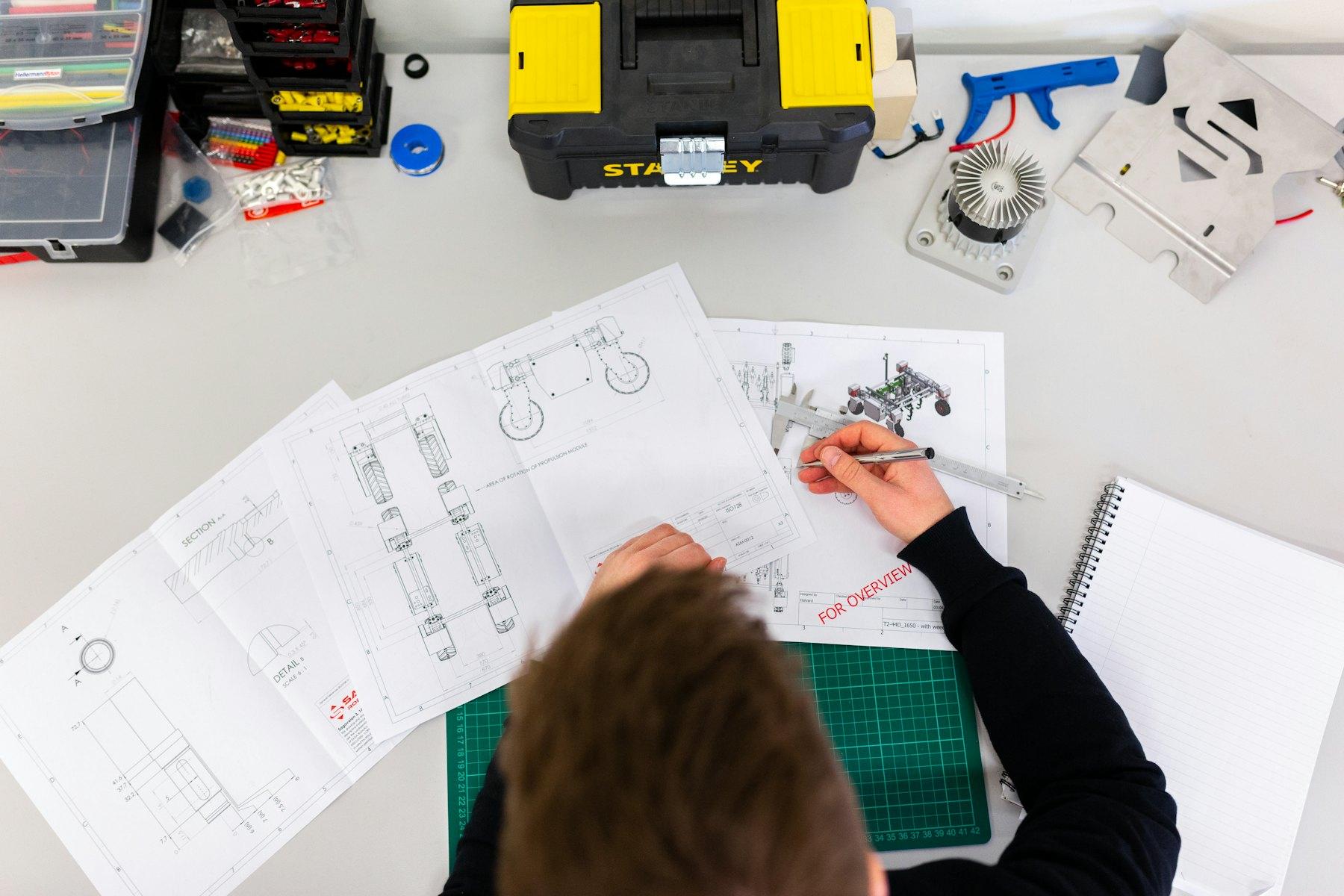 Engineer marking up technical drawings